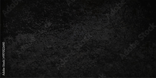 Rough black and white paper texture with a dark grunge pattern on a blank gray surface creates an old textured material backdrop