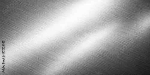 A polished silver plate features a brushed metal texture on a stainless steel surface with a shiny gray industrial material pattern and light metallic reflections for a sleek chrome backdrop