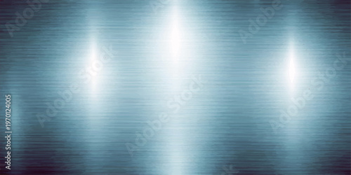 Abstract brushed metal texture featuring a shiny silver stainless steel pattern with a polished chrome surface and industrial grey reflections on a light metallic aluminum backdrop material