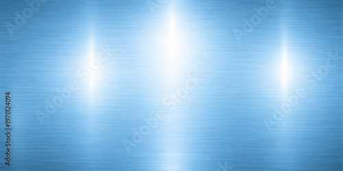 A shiny brushed silver metallic texture with a light grey industrial stainless steel pattern on a textured aluminum surface backdrop