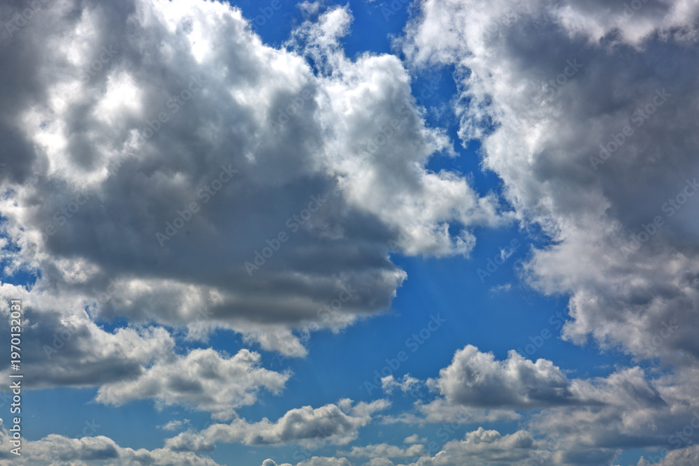 Fototapeta premium Blue sky with sunlight and beautiful white clouds.