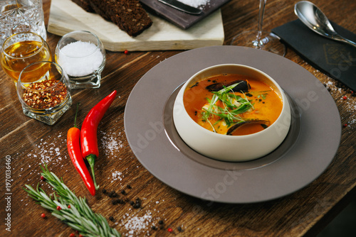 Fresh seafood soup with mussels and chili accents