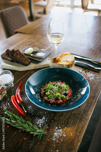Restaurant-style tartare with bread, herbs, and spices