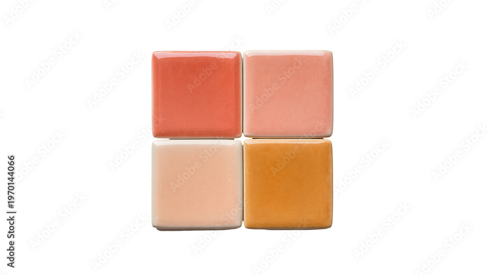 Fototapeta premium Four square ceramic tiles displaying coral salmon peach, and amber hues