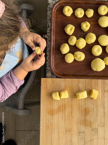 Child playing with dough, c...