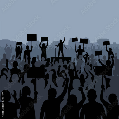 Silhouette of large protest crowd gathered for public demonstration against gray sky backdrop. Numerous people in protest crowd hold placards as speaker addresses audience from podium.