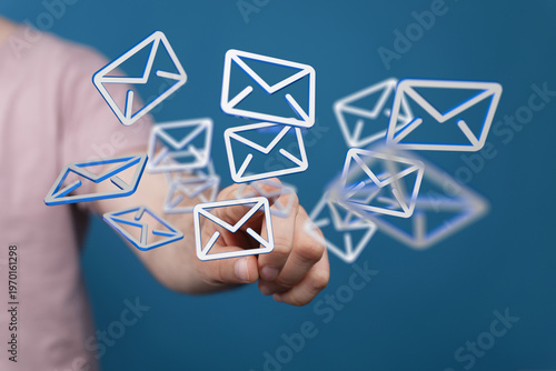 Hand holding floating email...