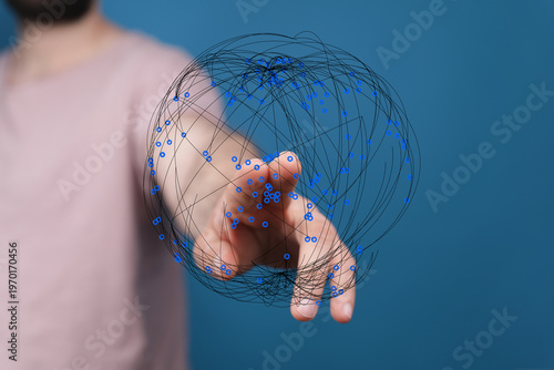 A person's hand reaching to...