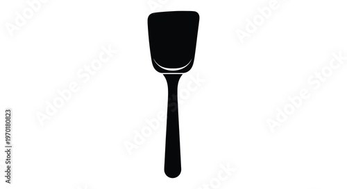 A simple black kitchen utensil specifically a spatula is displayed against a white background silhouette high quality professional