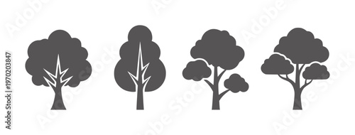 Four dark grey stylized trees with white branch details white nature silhouette