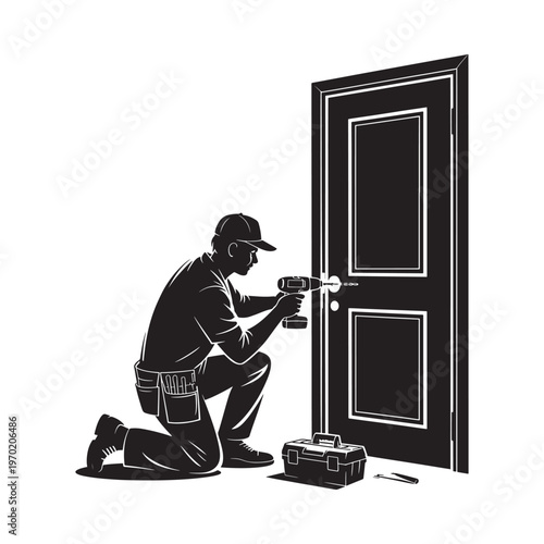 A worker installs hardware on a dark colored door with a power drill