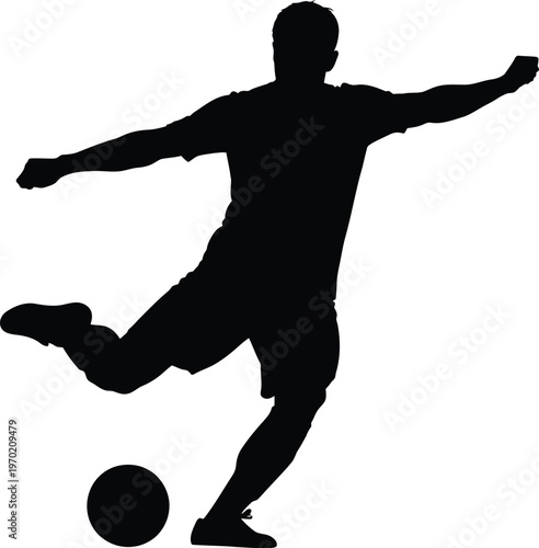 A black silhouette of a man kicking a soccer ball
