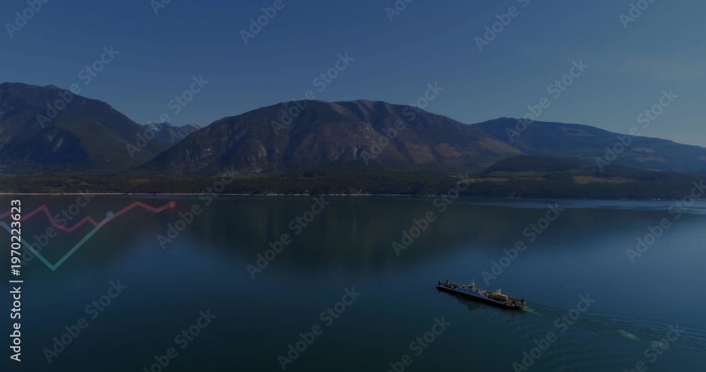 Fototapeta premium Gliding long ferry leaving V wake across reflecting mountain lake with zigzag, copy space