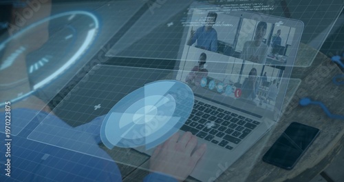 Typing user hands wearing blue long-sleeve shirt using laptop at wooden desk, with phone and UI