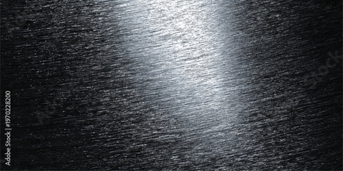 A dark brushed metal background featuring a textured stainless steel surface with a gray metallic pattern and shiny silver light reflections on a professional aluminum plate material design