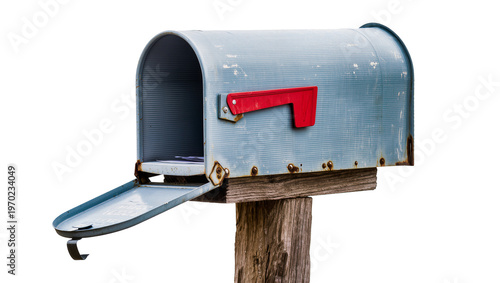 Isolated weathered blue rural mailbox with red flag open on rustic wooden post