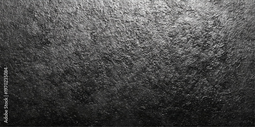 Dark and textured surface, reminiscent of a stormy sky or a rugged landscape.