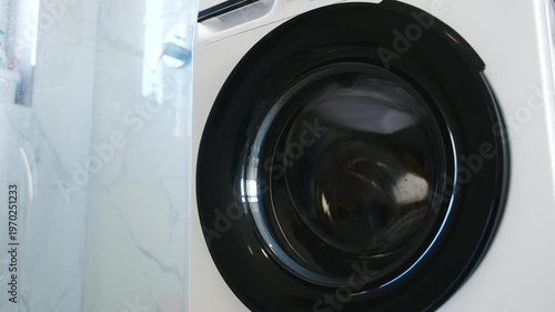 Laundry Process With Spinning Washer Machine Drum In Motion In Bathroom