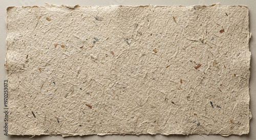 Title: A Natural Textured Handmade Paper Sheet with Rough Deckle Edges.