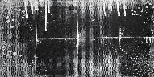 A textured grunge surface of old dark metal and wood displays a pattern of vintage rain drops falling down a dirty gray wall