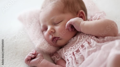 Newborn Baby Girl Wears Lace Dress While Sleeping During Photoshoot
