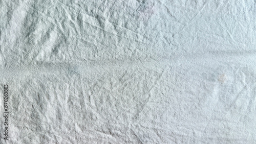 wrinkled white fabric macro closeup revealing horizontal crease and intricate fold textures in calm abstract style