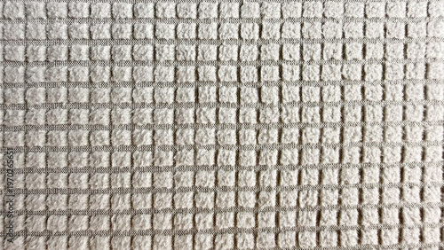 waffle weave towel macro closeup reveals soft beige intricate raised grid texture neutral tone