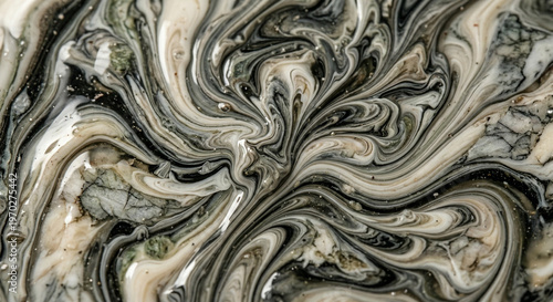 Title: A dramatic abstract macro photograph of swirling black, cream, and green liquid marble art.