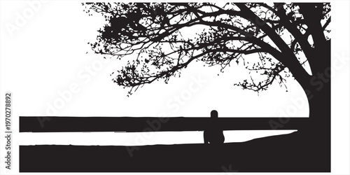Silhouette of a person sitting under a tree with a sunset view