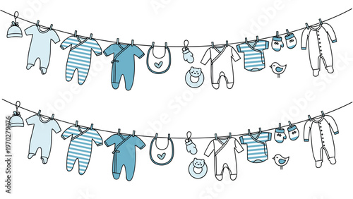 Two lines of baby clothing and accessories like bibs and hats are hung with pegs on a clothesline for drying in a laundry or shop concept.