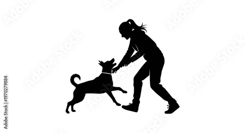 Silhouette of a woman playing with her dog, depicting companionship and joy.