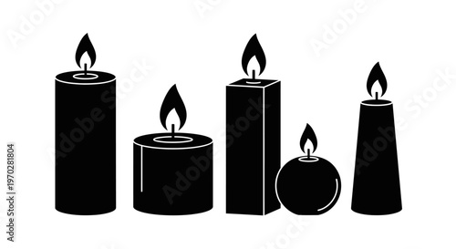 Collection of various burning candles in silhouette.