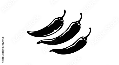 Three black chili peppers isolated on a white background.
