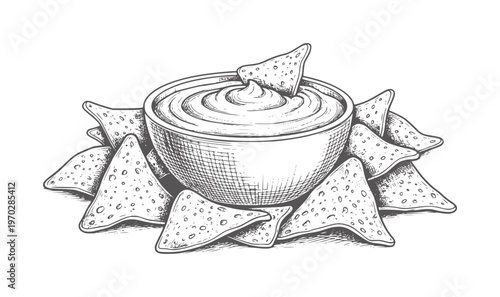 Black and white of hummus dip with nacho chips in a bowl nachos