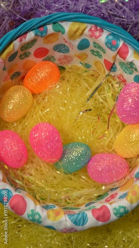 Vertical Shot Of Plastic Easter Eggs Falling Into A Basket