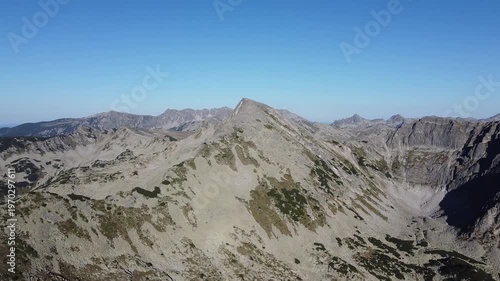 Clear Sky Aerial Over Rocky Pirin Mountain Ridge in Early Autumn