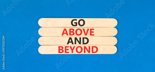 Fotografija Go above and beyond words symbol