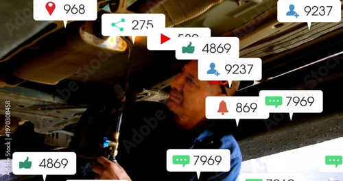 Mechanic under vehicle igniting torch and heating exhaust seam for auto repair while popups rising