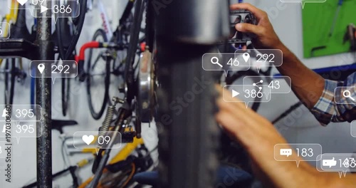 Social icons appearing and multiplying, bike mechanic truing wheel and testing pedal for repair