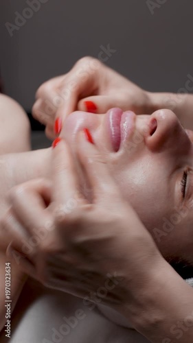 lymphatic facial massage in a spa salon, rejuvenation beauty treatment, professional wellness and healthcare, deep facial massage procedure
