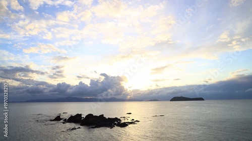 Seaside town of Turgutreis and spectacular sunsets. Bodrum, Turkey. A large rock in the middle of the Aegean Sea.	
