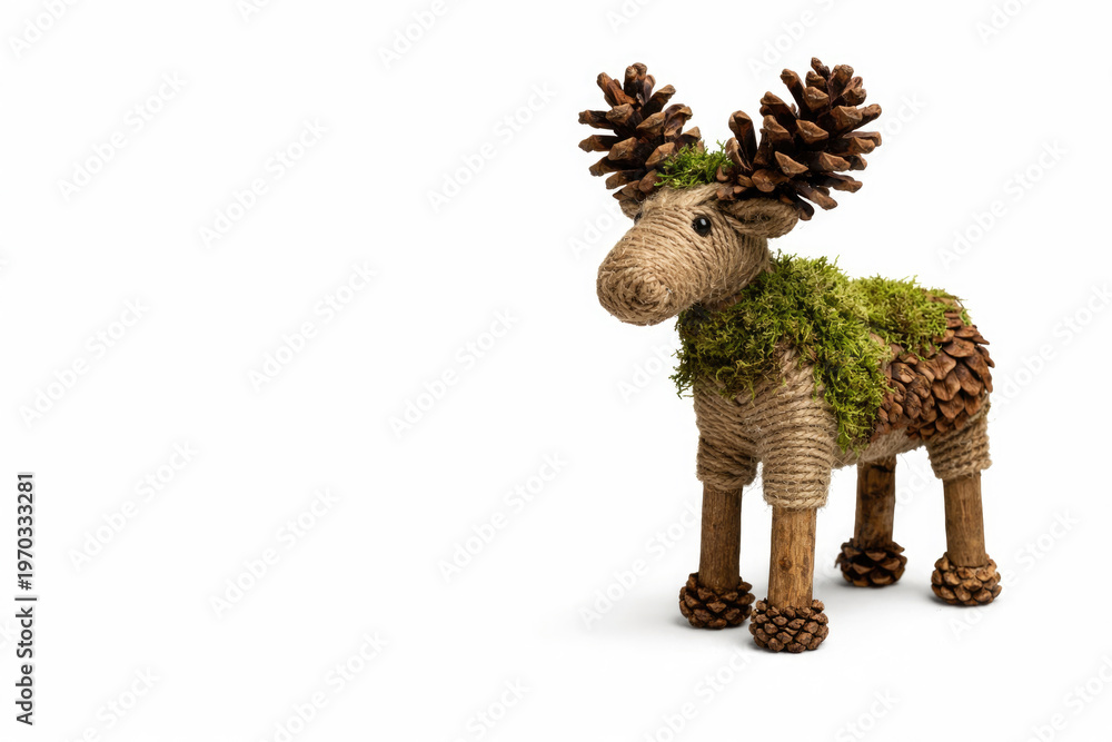 Fototapeta premium Decorative moose made of cones, moss and rope. Space for text.