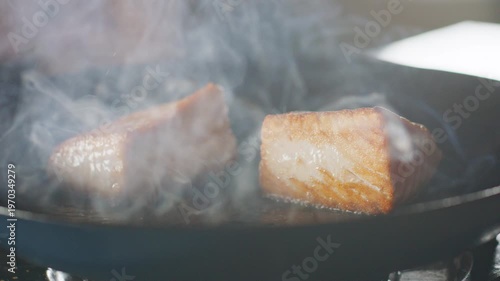 Wallpaper Mural Salmon steaks sizzling in a hot skillet, developing a golden crispy crust. Torontodigital.ca