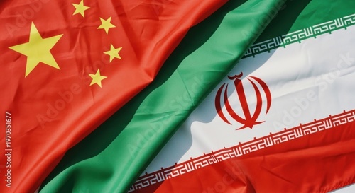 Closeup of Chinese and Iranian flags draped together symbolizing international relations.