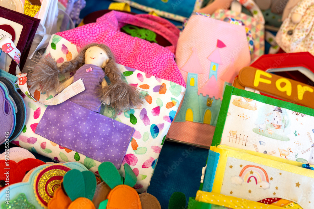 Fototapeta premium Educational soft fabric books and sensory toys for toddlers with bright patterns.