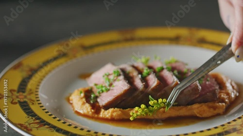 Wallpaper Mural Chef garnishes NY Strip steak slices with fresh chives using tweezers. Torontodigital.ca