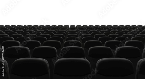 An empty auditorium filled with rows of black seats under a bright white light, ready for an audience