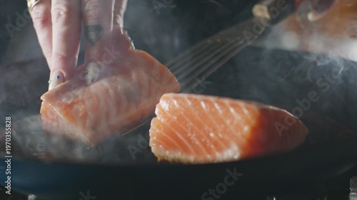Wallpaper Mural Salmon fillets flipped in a frying pan with a spatula. Torontodigital.ca