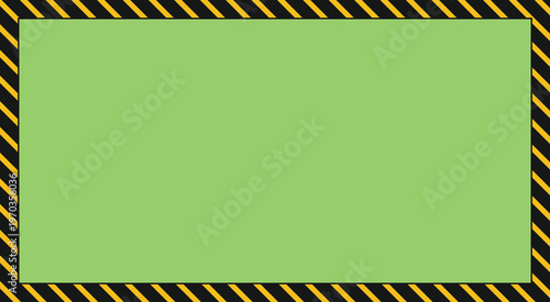 Green screen with yellow and black caution border for video editing and motion graphics