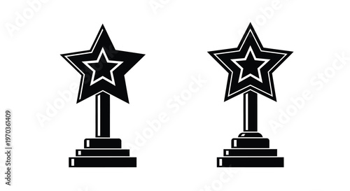 Two black star trophies on pedestals a striking silhouette